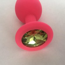 Розовая силиконовая пробка с салатовым стразом